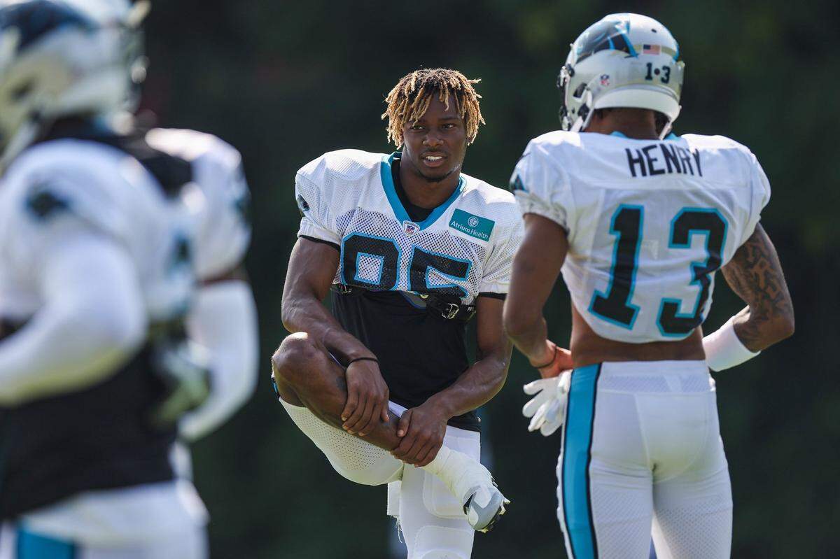 Panthers tight end Charleston Rambo, center, stretches before practice at Training Camp on Tuesday, August 2, 2022 in Spartanburg, SC.