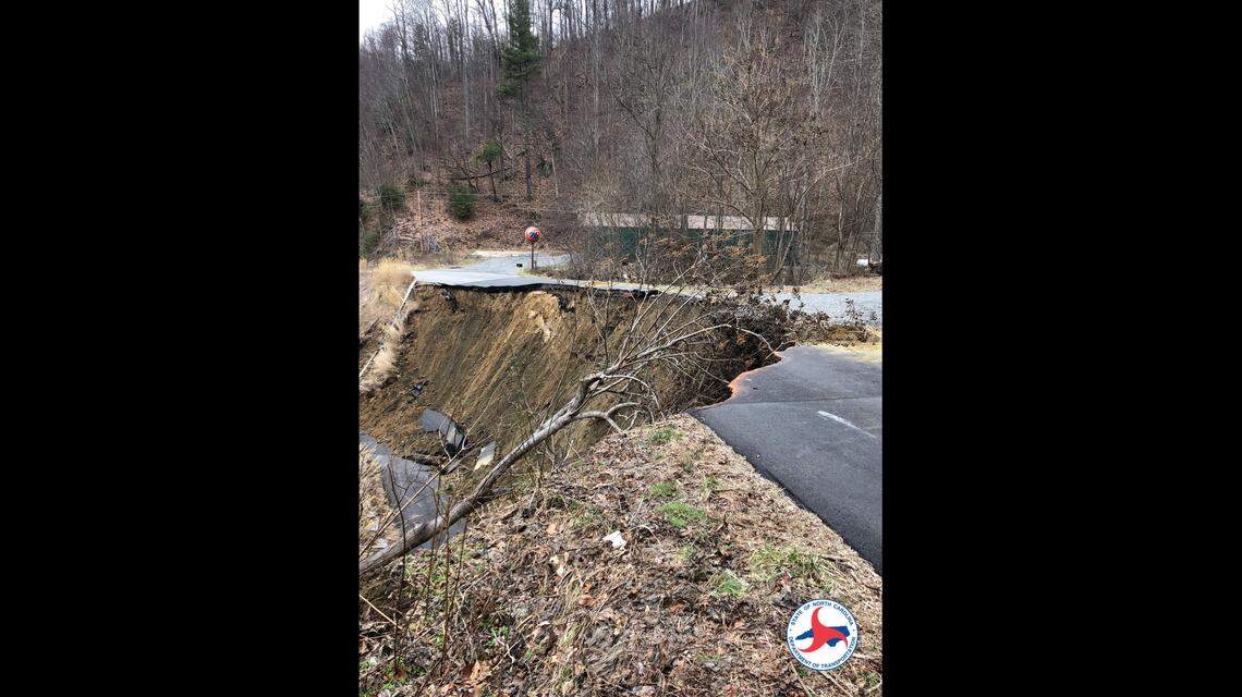 A landslide pushed part of a roadway down an embankment in Western North Carolina, officials say.