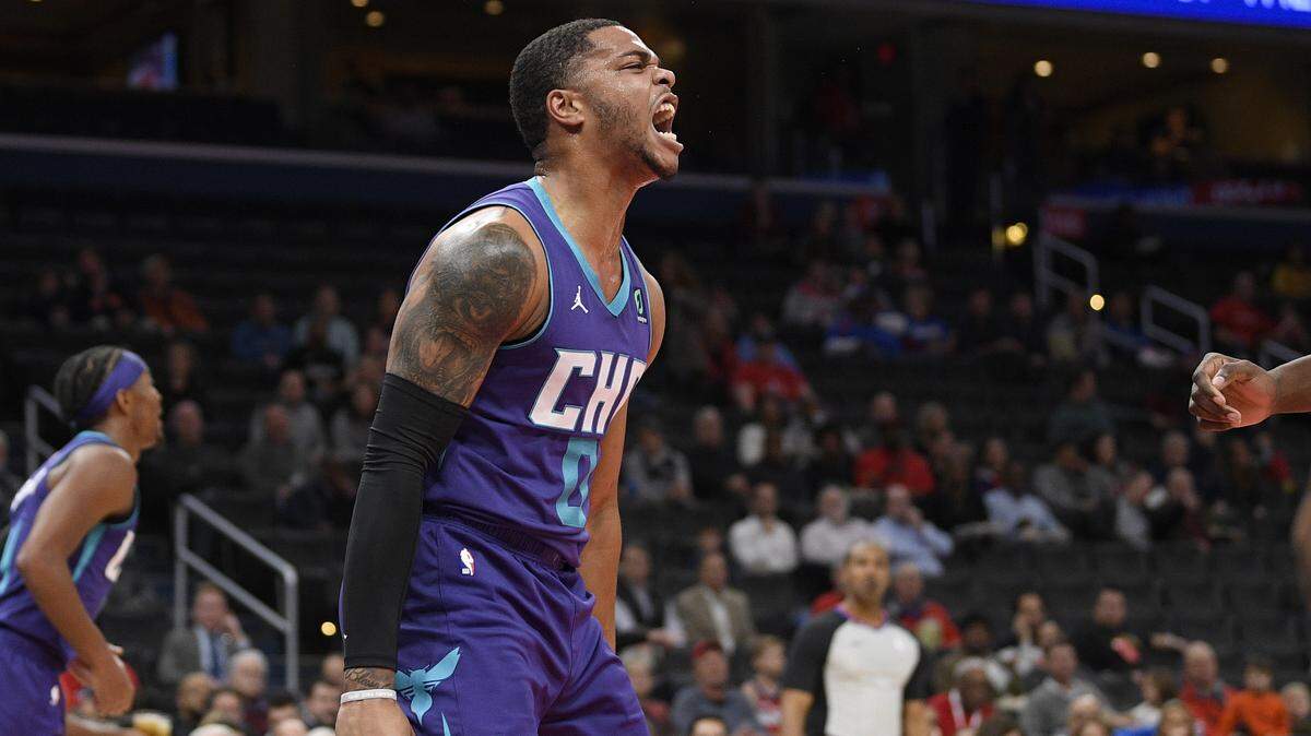 Charlotte Hornets forward Miles Bridges (0) reacts after his dunk during the first half of an NBA basketball game against the Washington Wizards, Friday, Nov. 22, 2019, in Washington. (AP Photo/Nick Wass)