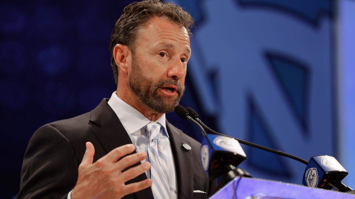 North Carolina football coach Larry Fedora answers a question during the 2018 ACC Kickoff in Charlotte.