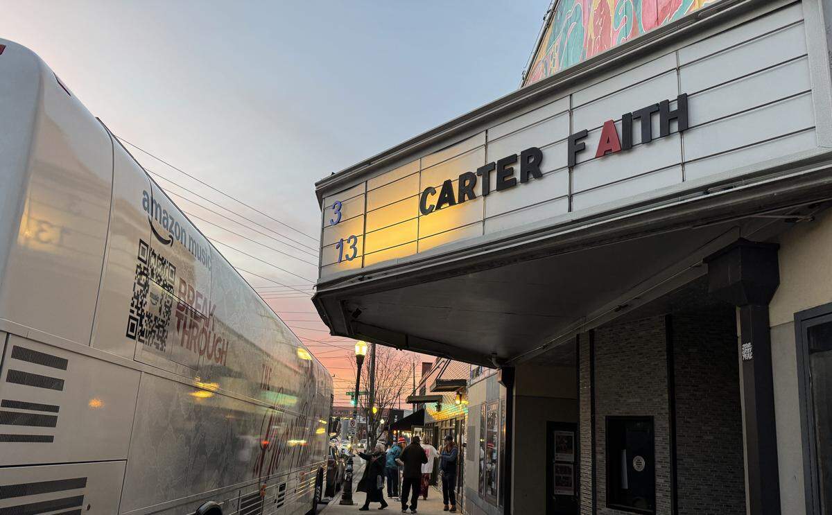 Carter Faith’s name graces the marquee at the Neighborhood Theatre last Friday, as her “Cherry Valley” tour bus sits parked right out front.