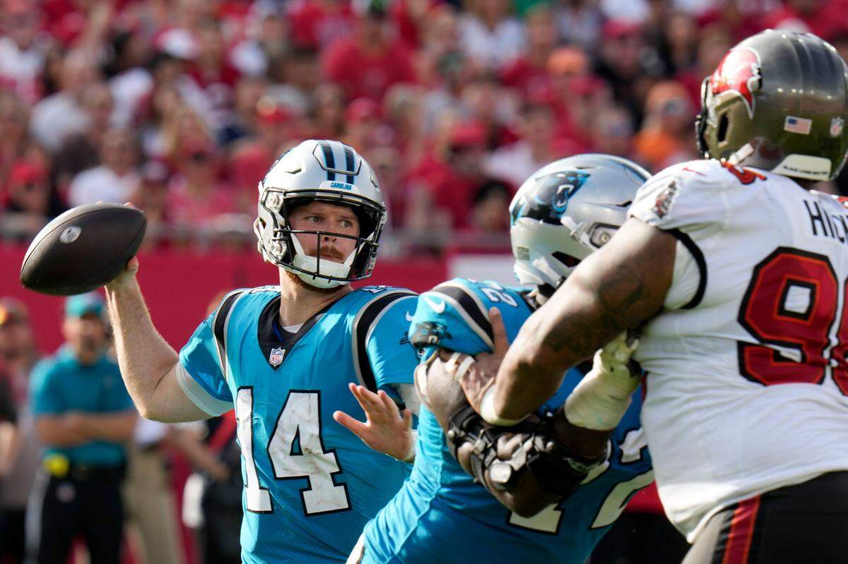 Carolina Panthers quarterback Sam Darnold passes during the second half of an NFL football game between the Carolina Panthers and the Tampa Bay Buccaneers on Sunday, Jan. 1, 2023, in Tampa, Fla. (AP Photo/Chris O’Meara)
