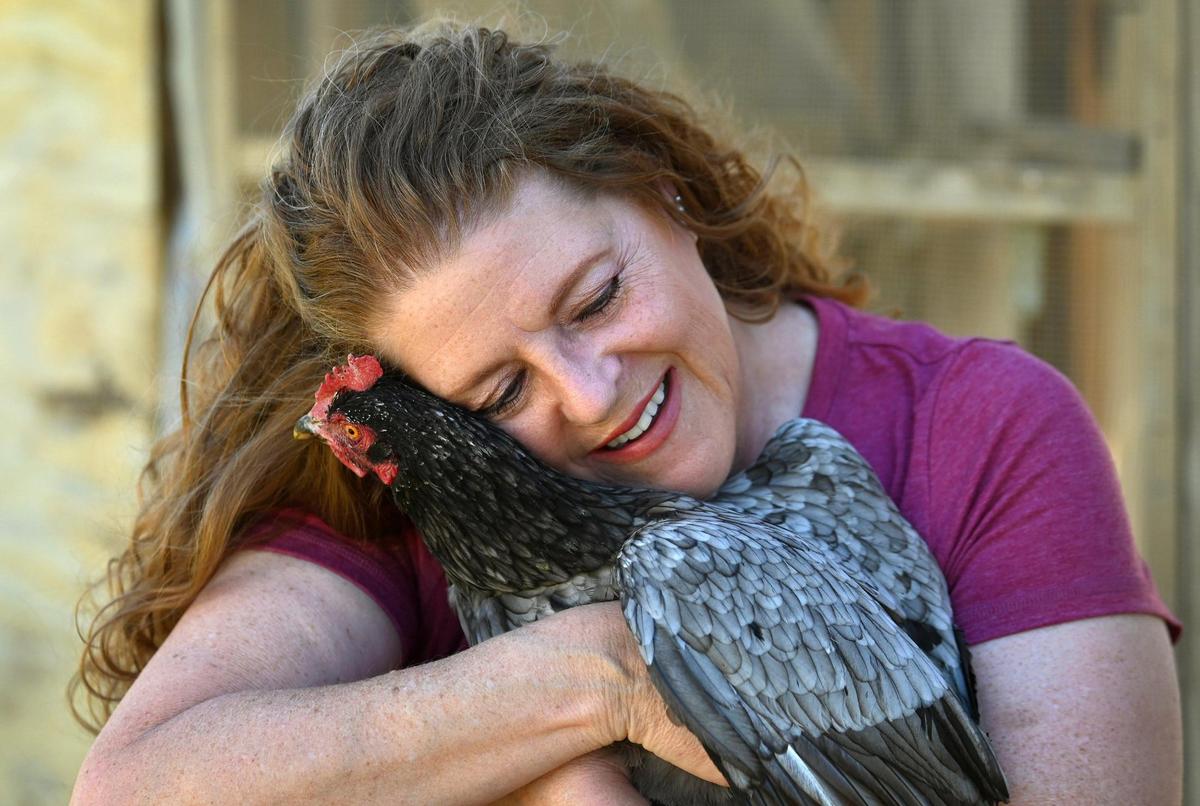 Mary Schroeder hugs Blue on Wednesday.