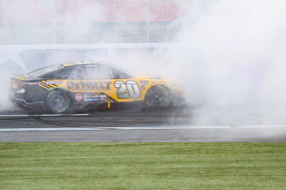 NASCAR Cup Series driver Christopher Bell (20) burns out after winning the Bank of America Roval 400 at Charlotte Motor Speedway in Charlotte, N.C., Sunday, Oct. 9, 2022.