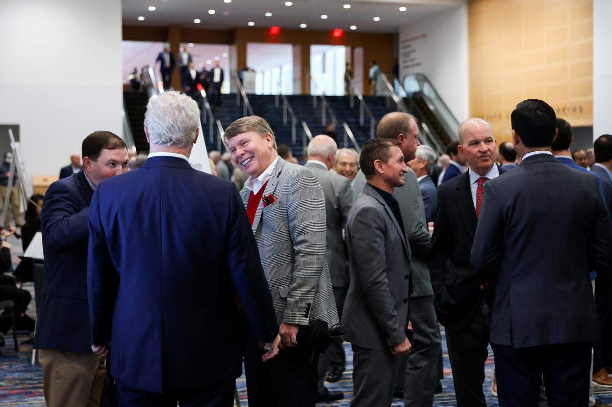 Guests mingle before the Good Fellows Luncheon at the NASCAR Hall of Fame on Wednesday in Charlotte