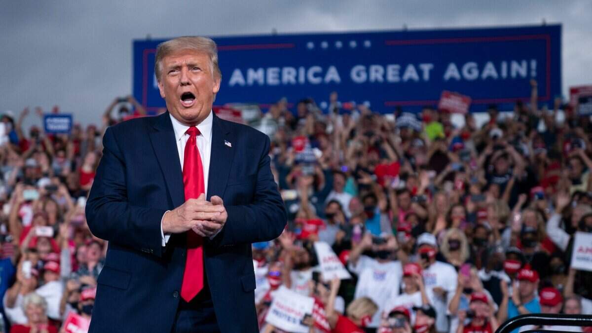 President Donald Trump reacts to the crowd as he arrives to speak at a campaign rally at Smith Reynolds Airport, Tuesday, Sept. 8, 2020, in Winston-Salem, N.C.