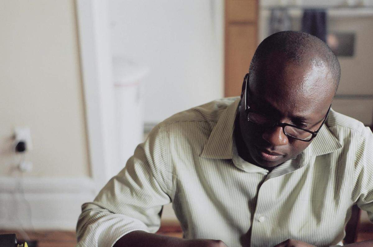 Dimeji Onafuwa, a designer, painter and senior researcher at Microsoft is featured in the exhibit. His paintings usually focus on a single subject surrounded by a brightly-colored background.