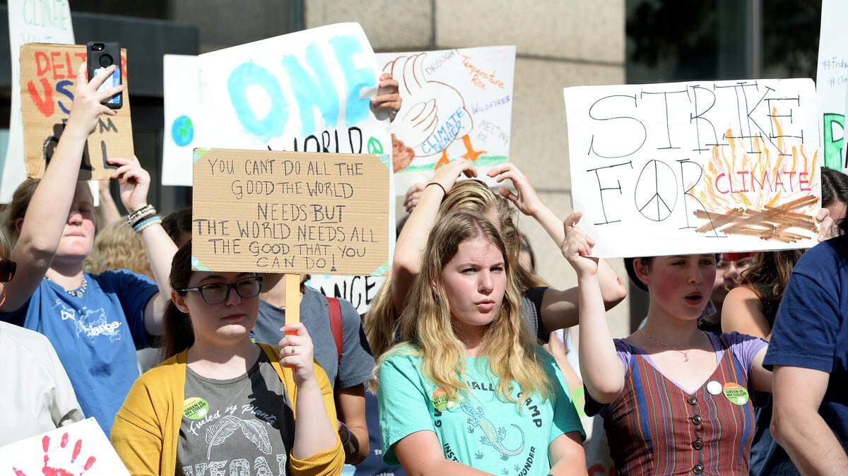 Hundreds of people, most of them students, gathered outside the Charlotte-Mecklenburg County Government Center on Sept. 20, 2019 to protest inactivity to what they see as a the global crisis of climate change.