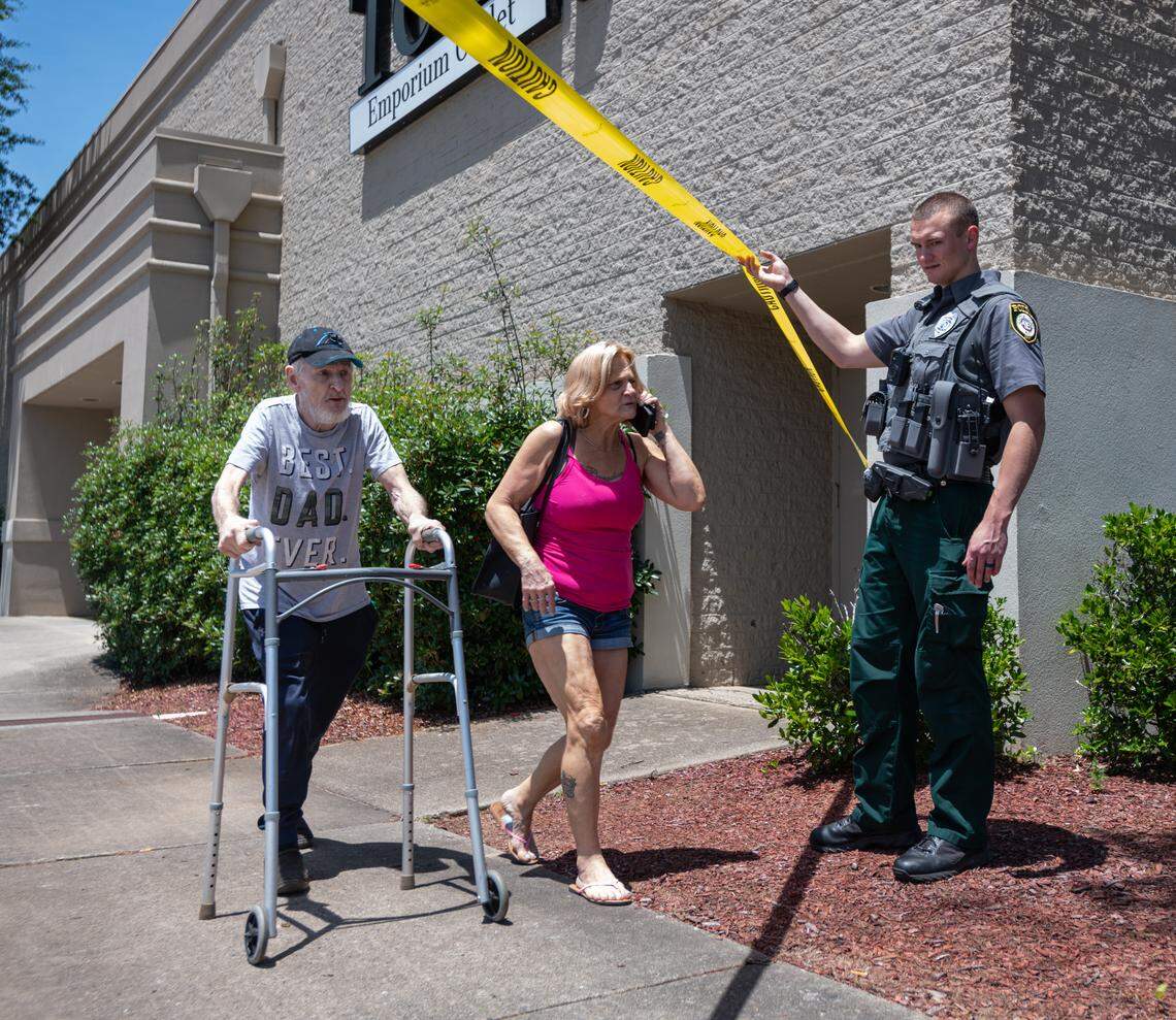 Police escort shoppers away from the scene of a shooting at Eastridge Mall in Gastonia, North Carolina, on Friday, June 12, 2022.