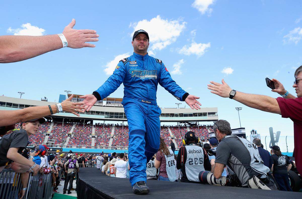 AVONDALE, ARIZONA - MARCH 08: Reed Sorenson, driver of the #77 Spire Motorsports Chevrolet, high fives fans as he is introduced to the NASCAR Cup Series FanShield 500 at Phoenix Raceway on March 08, 2020 in Avondale, Arizona. (Photo by Christian Petersen/Getty Images)