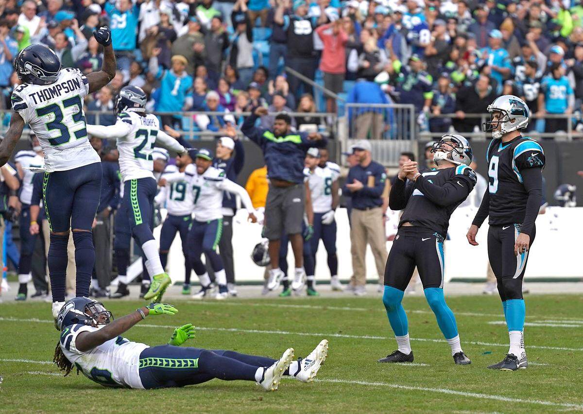 Carolina Panthers kicker Graham Gano, right, and holder/punter Michael Palardy react to Gano’s missed 52-yard, fourth-quarter field goal attempt Sunday. Gano missed the kick wide right after missing an extra point and a field goal wide left the previous week in another Panthers loss, to Detroit. The Seahawks defeated the Panthers 30-27.