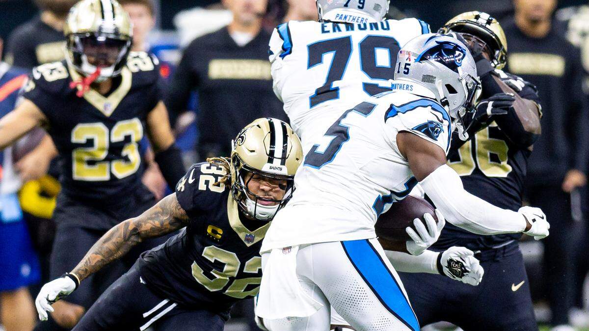 New Orleans Saints safety Tyrann Mathieu (32) forces a fumble on the run of Carolina Panthers wide receiver Jonathan Mingo (15) during the first half at Caesars Superdome.