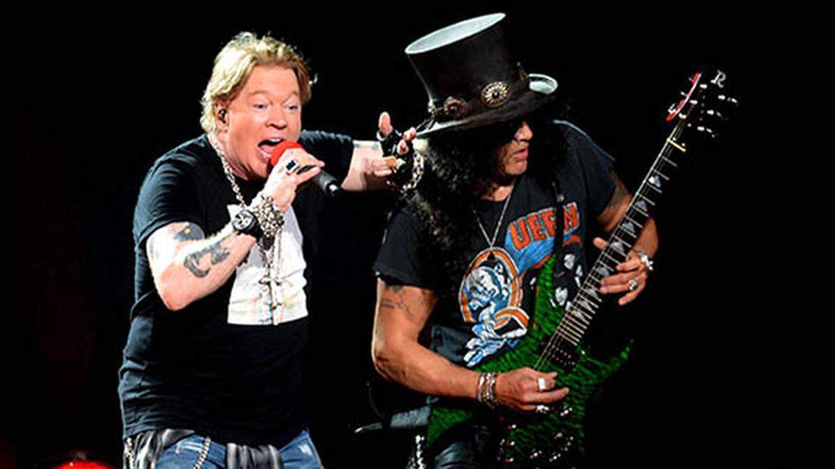 Axl Rose, left, of Guns N’ Roses performs next to guitarist Slash, right, during the “Not in This Lifetime Tour at Spectrum Center in Charlotte, NC on Wednesday, September 25, 2019.