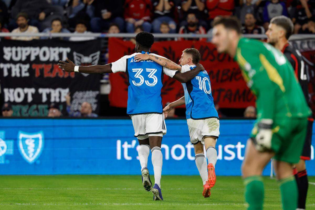 Charlotte FC midfielder Pep Biel (10) celebrates with forward Patrick Agyemang (33) after scoring a goal against D.C. United in the second half at Audi Field.