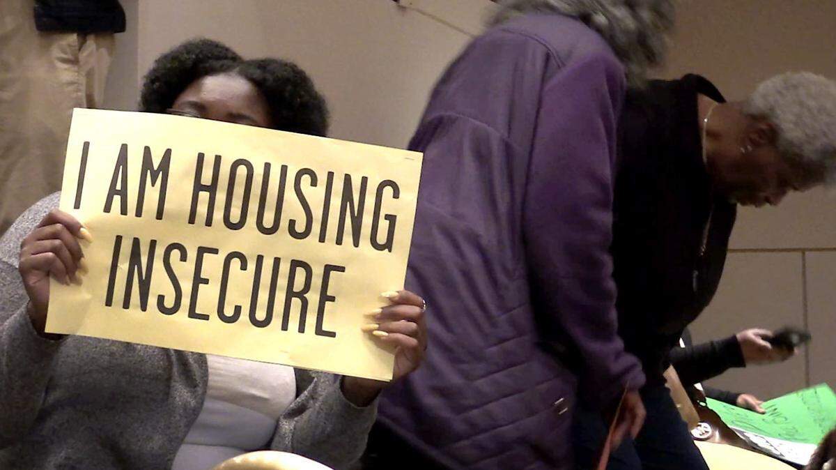Citizens arrived at the Charlotte City Council meeting on Monday, April 9, 2018 with signs referencing affordable housing.