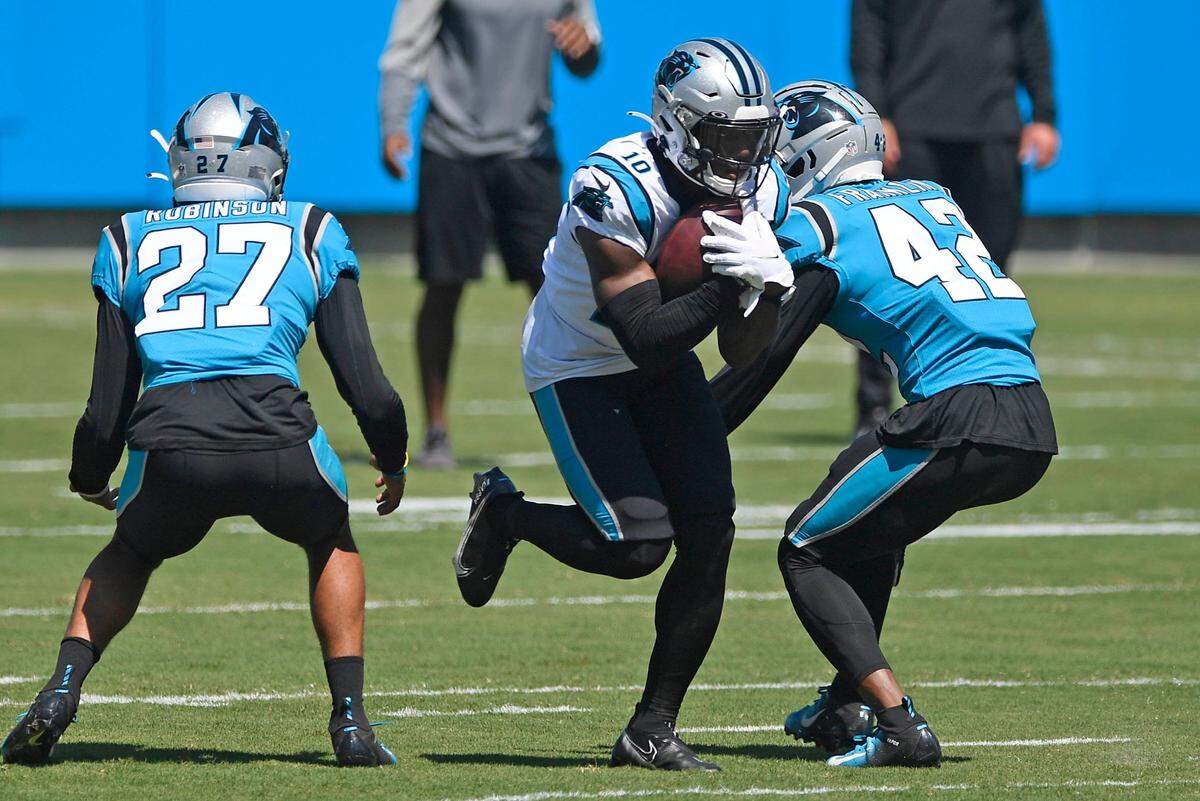 Carolina Panthers wide receiver Curtis Samuel (10) heads up field against linebacker Sam Franklin (42) and safety Kenny Robinson (27) during practice at Bank of America Stadium on Friday, September 4, 2020.