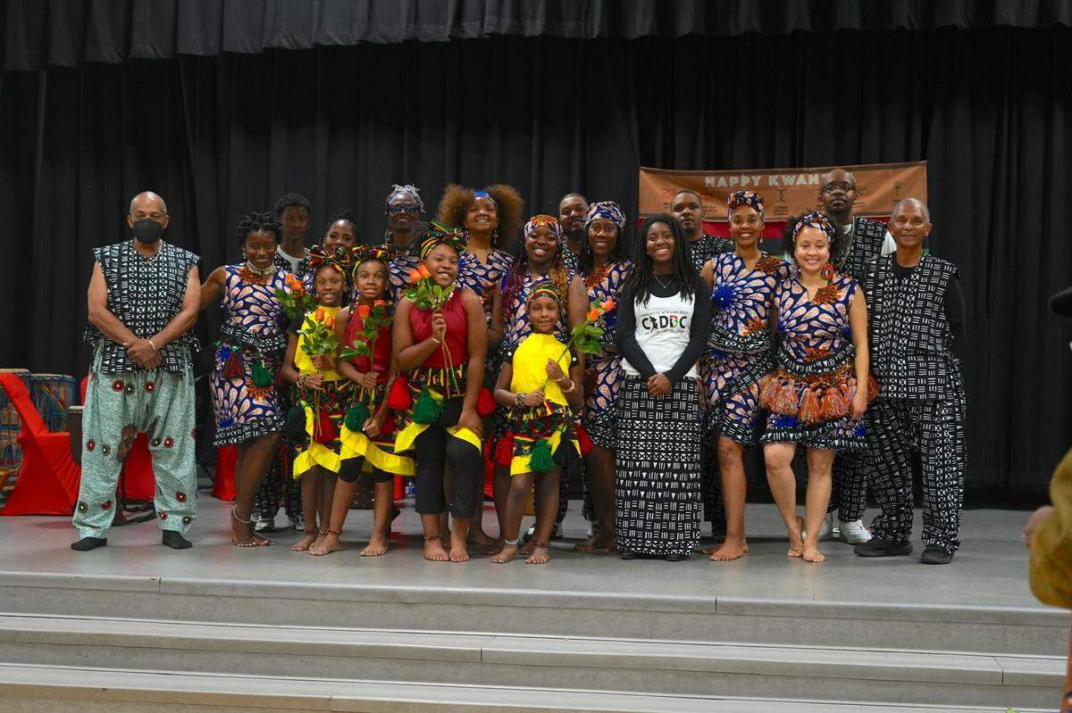 Community, youth and company dancers with the Charlotte African Drum and Dance Collective at a Kwanzaa performance in 2024.