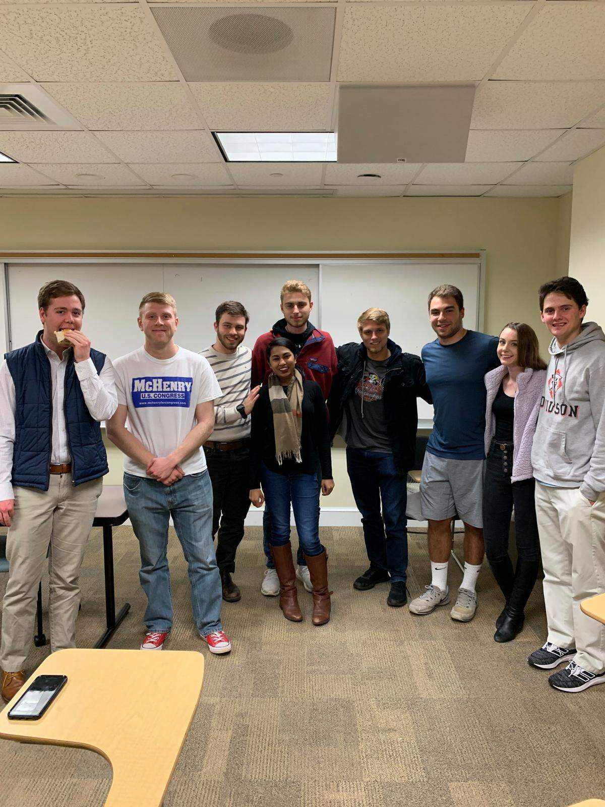 Maya Pillai, center, with other club members at a Davidson College Republicans meeting.
