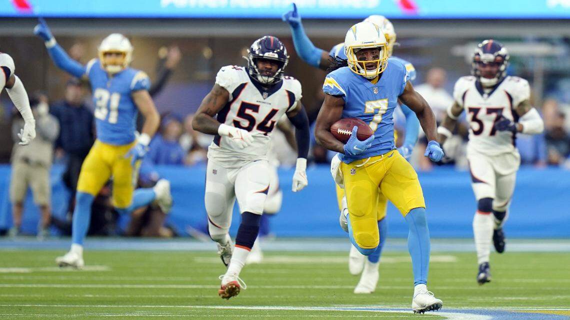Los Angeles Chargers wide receiver Andre Roberts (7) returns a kick for a touchdown during the second half of an NFL football game against the Denver Broncos Sunday, Jan. 2, 2022, in Inglewood, Calif. (AP Photo/Jae C. Hong)