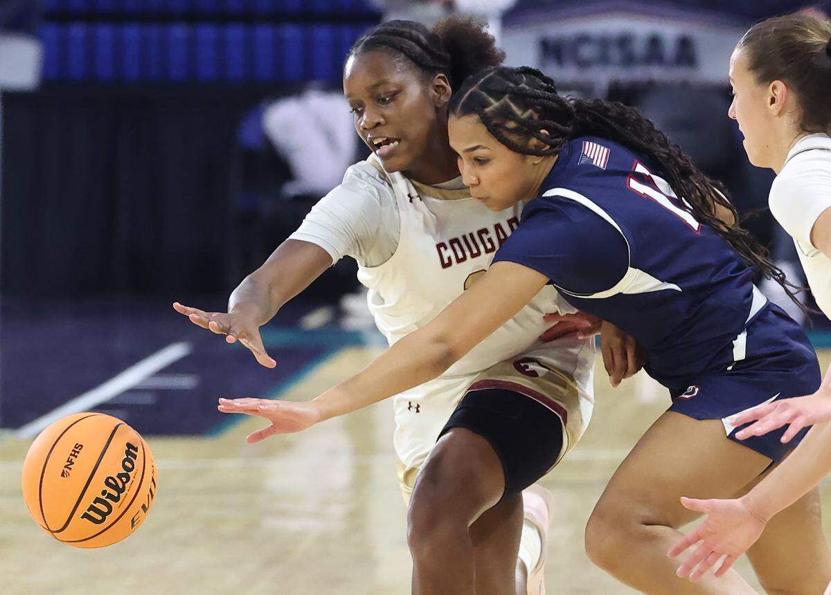 Cannon School’s Jaiden Thompson, left, looks to steal the ball from Providence Day’s Layla Clark, right, during action in the NCISAA girls state championship game on Saturday, February 28, 2026 at Novant Fieldhouse in Greensboro, NC. 