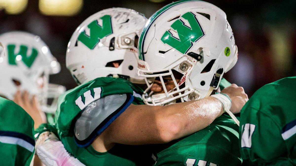 Weddington players celebrate their win over Charlotte Catholic on Friday night .