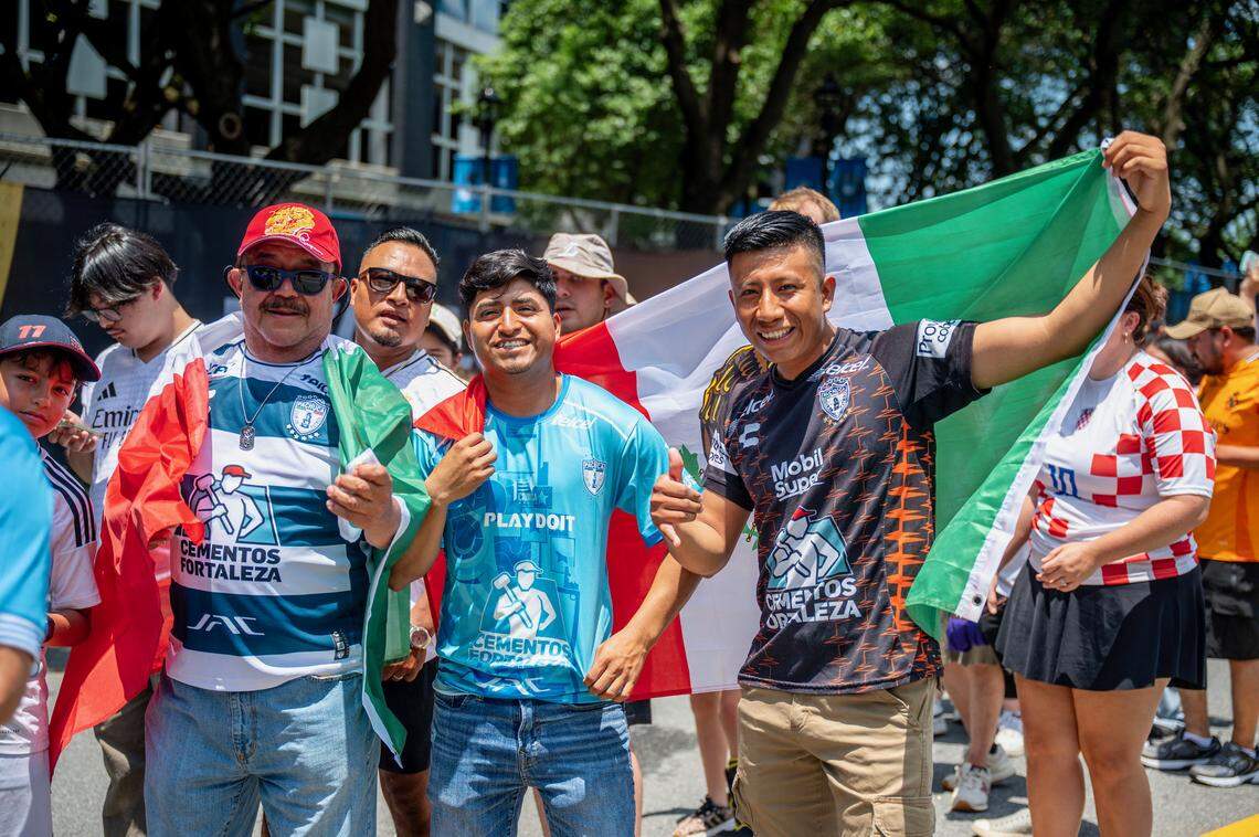 Fans gather at Bank of America in uptown Charlotte to cheer for their team: of Real Madrid and CF Pachuca play in Club World Cup Sunday, June 22, 2025. Simón Terran, center, and Rodrigo Hernandez, right.