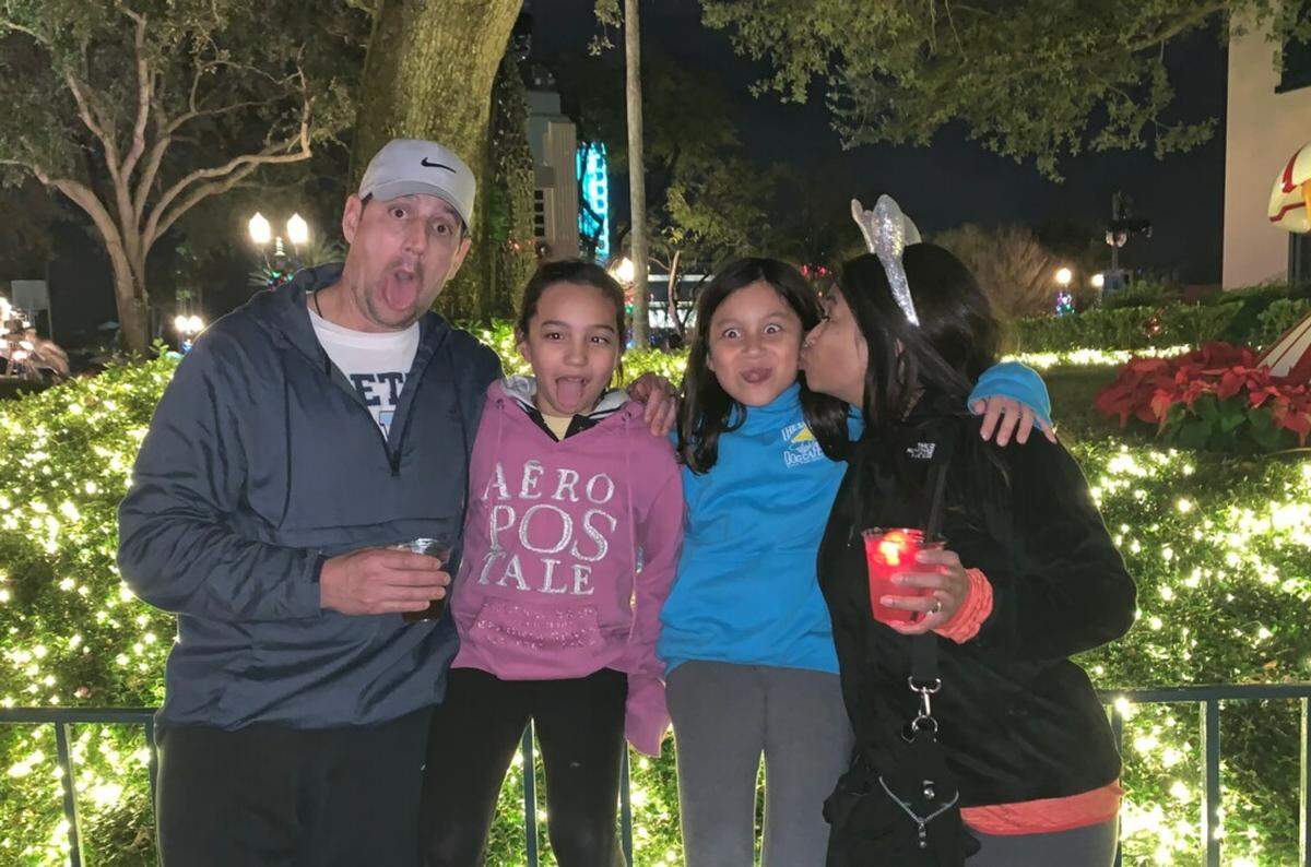The Sigmund family, from left: Matt, Violet (then 11), 10-year-old Layla and Jenny, photographed during a trip to Disney World in December.
