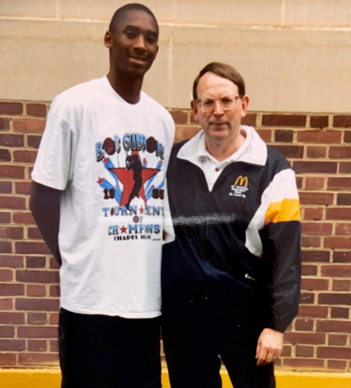 In the mid-1990s, high schooler Kobe Bryant (left) posed for a photo with basketball scout Bob Gibbons.