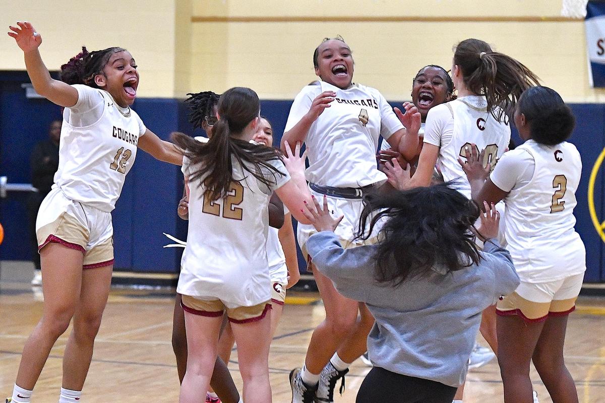 The Cannon School’s Maya McCorkle (4) and teammates celebrate after their victory over Providence Day in the NCISAA 4A Girls Basketball Championships in Raleigh N.C. The Cannon School and Providence Day School met in the NCISAA 4A Girls Finals in Raleigh, N.C. on February 24, 2024.