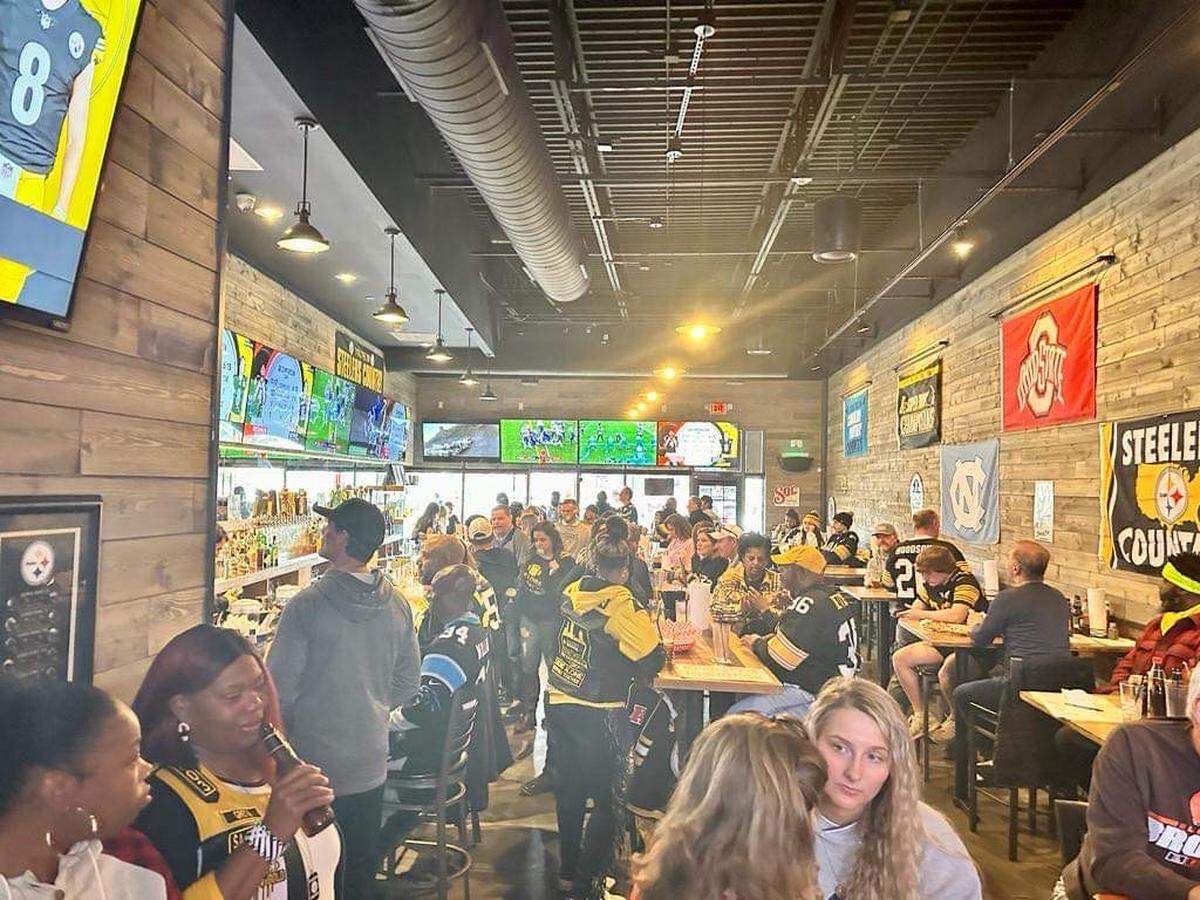 You can see a TV from nearly every seat in the house at 12th Man Sports Pub.