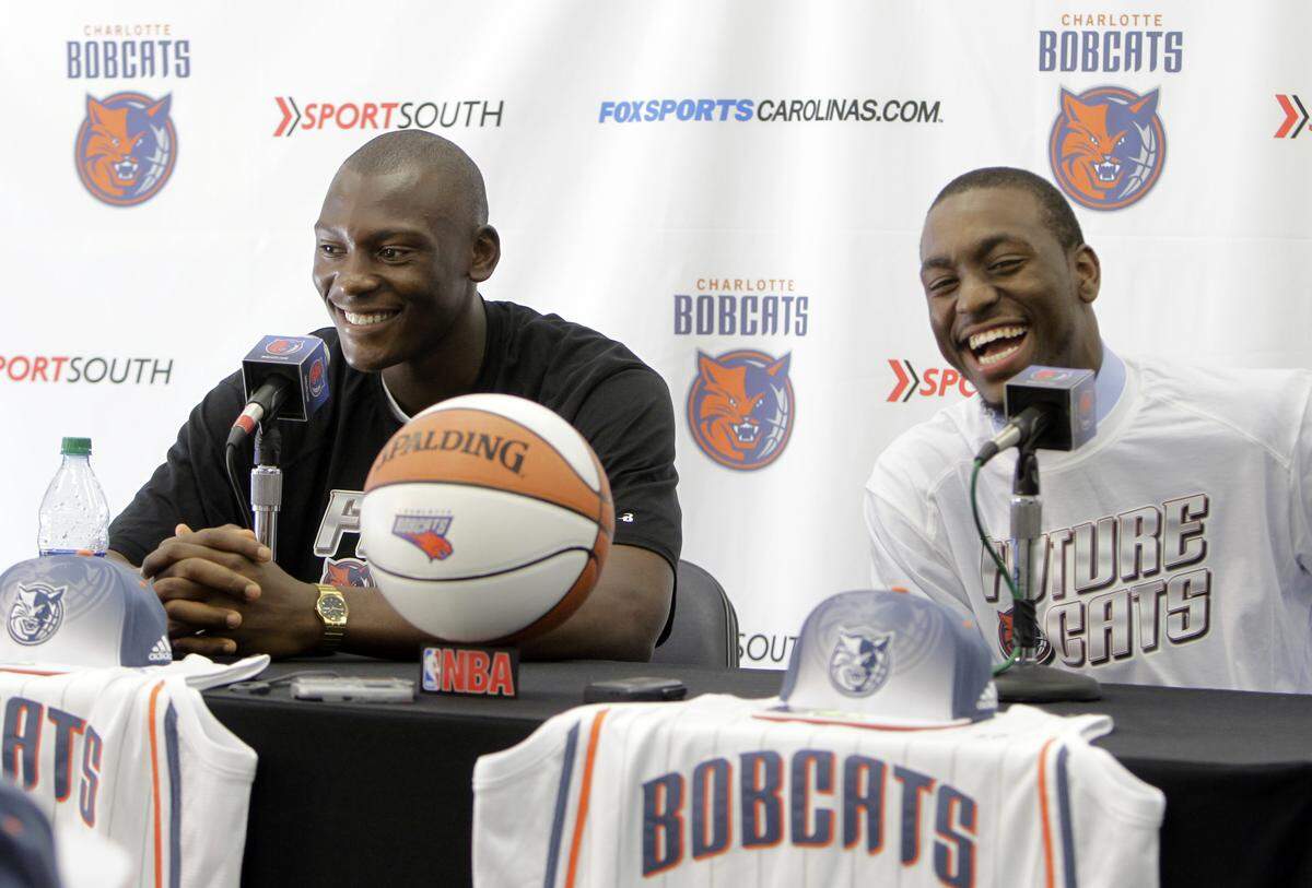 In 2011, Kemba Walker (right) and Bismack Biyombo both joined the Hornets as first-round picks. While Walker has now left for Boston, Biyombo is back with the team and one of the many players whose pay exceeds his production.
