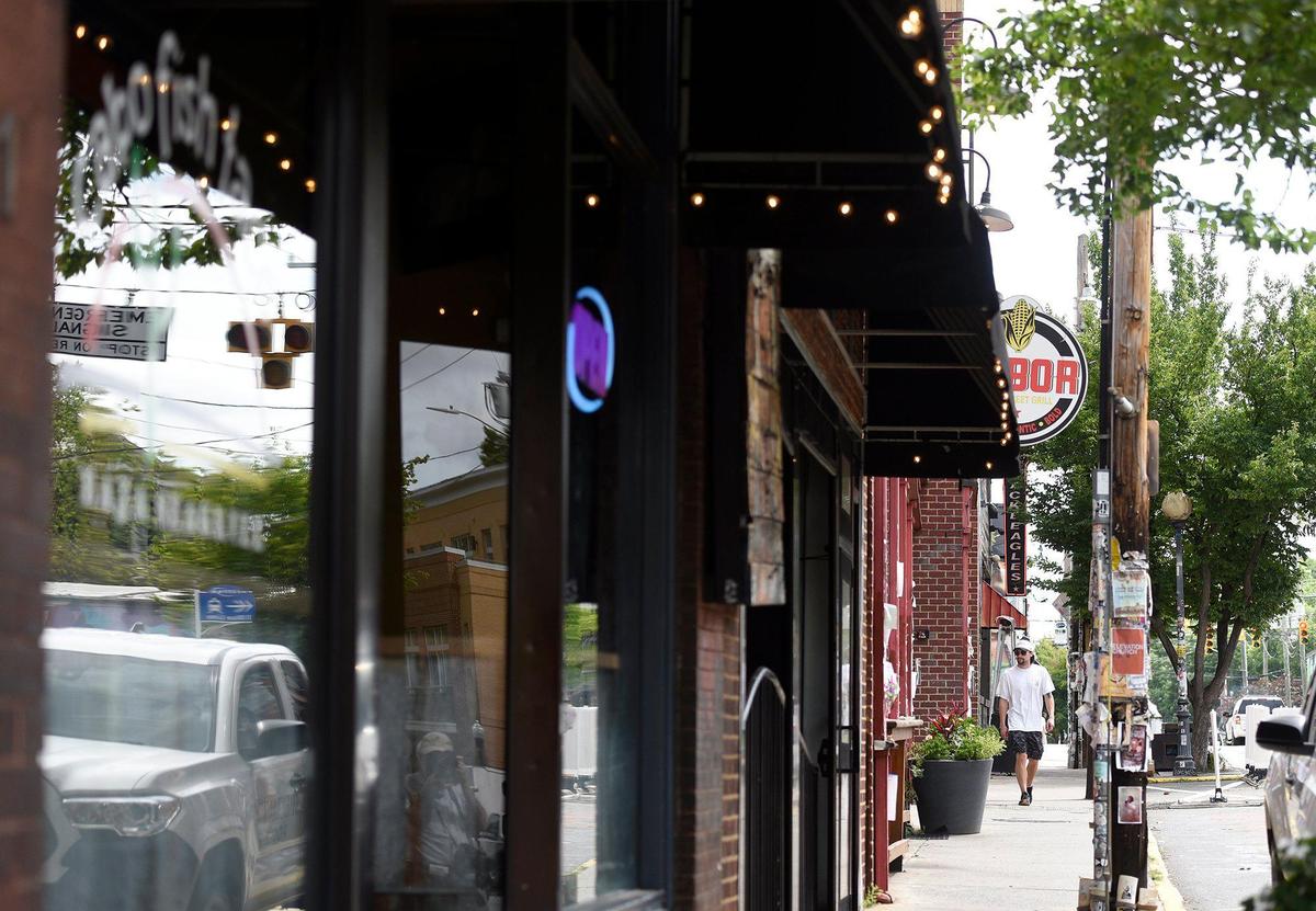 Space is tight along the narrow sidewalks lining North Davidson Street.