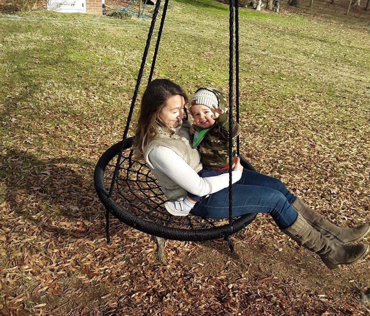 Shelby Helms swings with her 17-month-old son Lucas, who has allergies to eggs, peanuts, tree nuts and bananas.