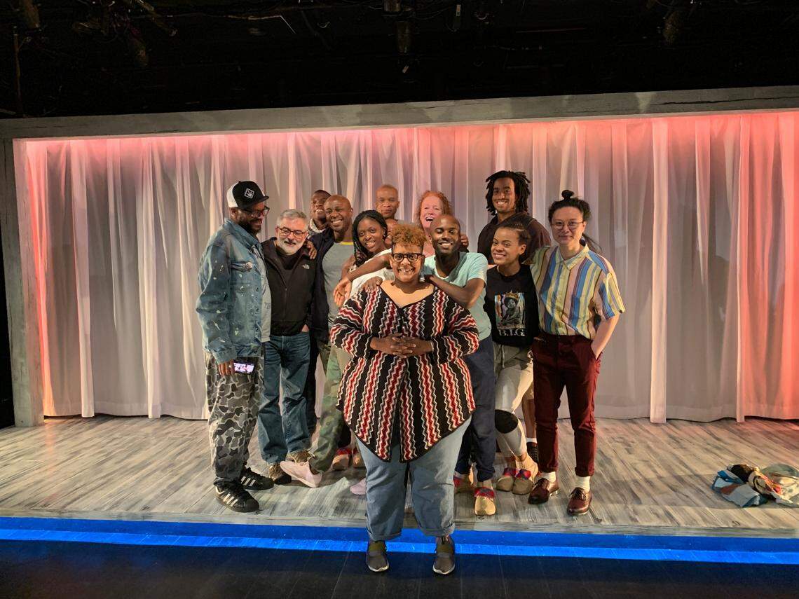 Charlotte playwright Stacey Rose (front) stands with the cast and crew of her award-winning 2019 play “America v. 2.1: The Sad Demise & Eventual Extinction of the American Negro.”