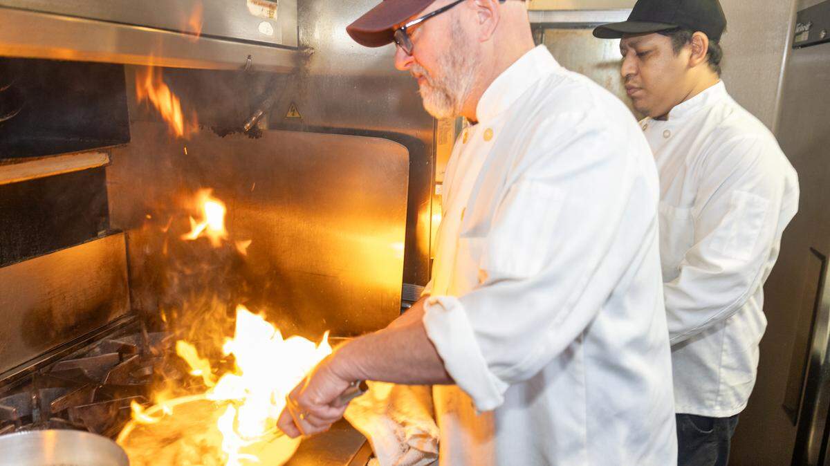 Chef Greg Zanitsch fires up a dish at The Fig Tree on Wednesday, Feb. 19. The fine-dining restaurant has been feeding Charlotte diners since 2005.