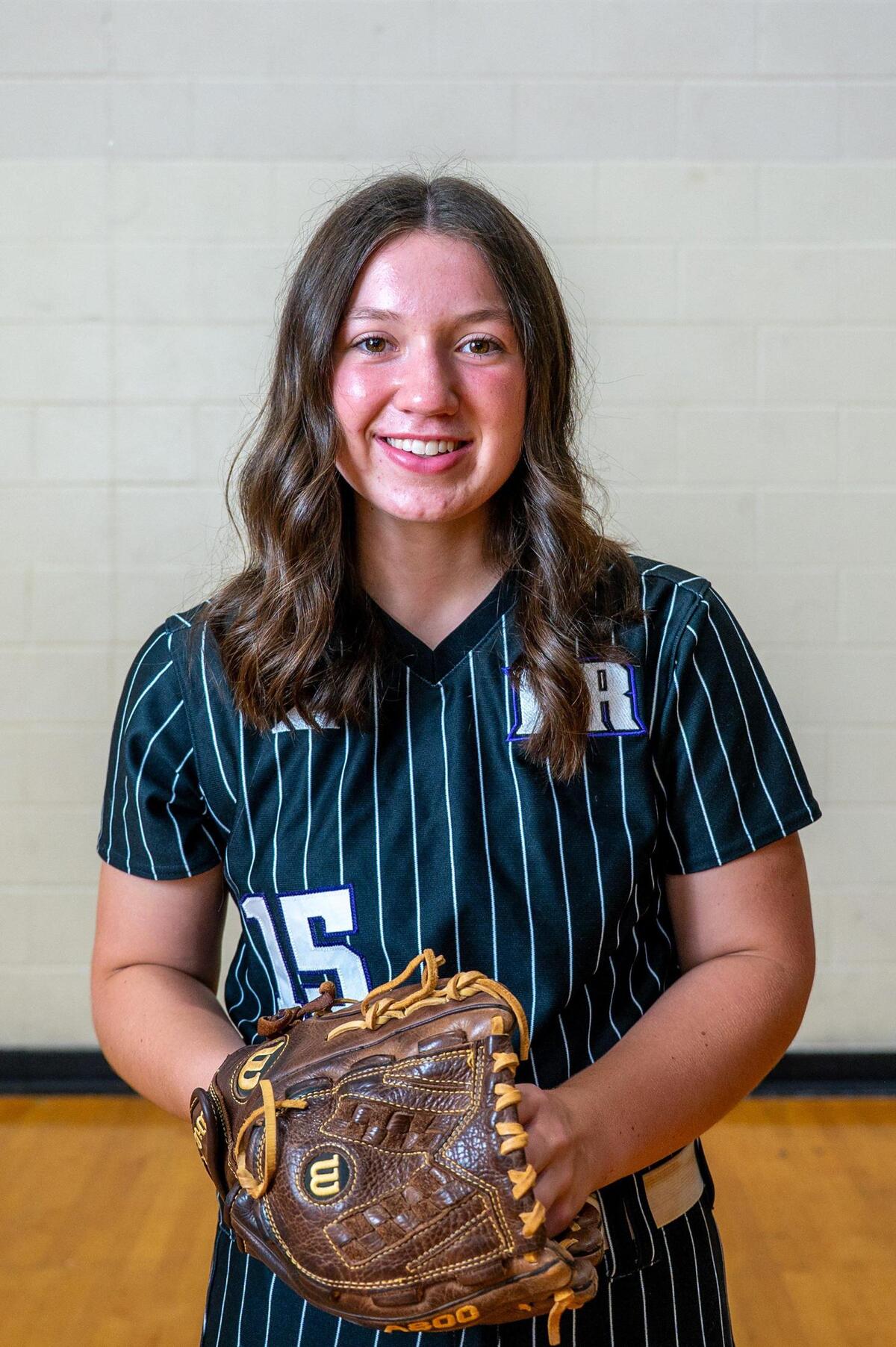 Scholar-athlete of the year Emma Daniels poses for a portrait at Independence High School. Daniels, a recent graduate of Porter Ridge High School, has been recognized as a top athlete in softball and is set to attend UNC.