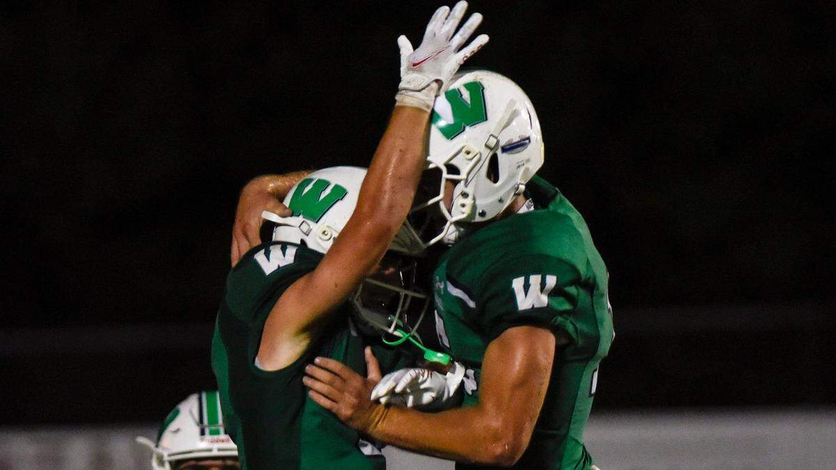 Weddington wide receiver, Landyn Backey, left, and quarterback Grady Brosterhous, celebrate after Backey scores a touchdown during the football game against Charlotte Christian on Friday, August 20, 2021 in Weddington, NC. Backey’s touchdown would put Weddington over Charlotte Christian with a final score of 14-7.