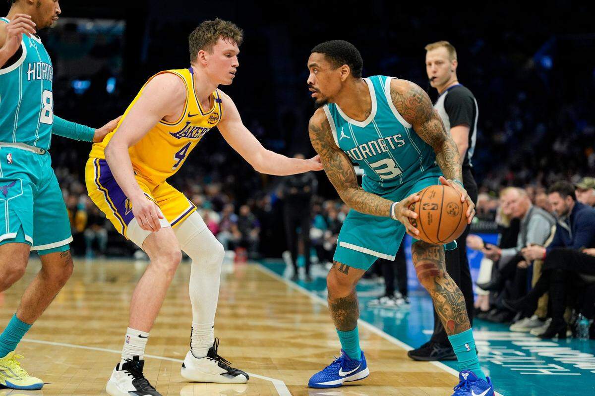 Dalton Knecht (left) won’t be playing for the Charlotte Hornets after all, because the L.A. Lakers have rescinded the trade that was sending him to the Hornets.