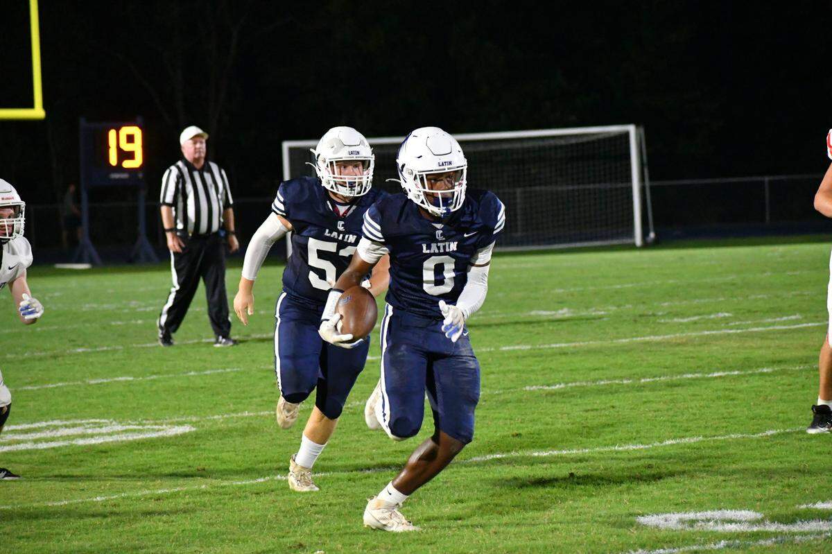 Charlotte Latin’s Titus Ivory scores on a long touchdown pass against Covenant Day Wednesday