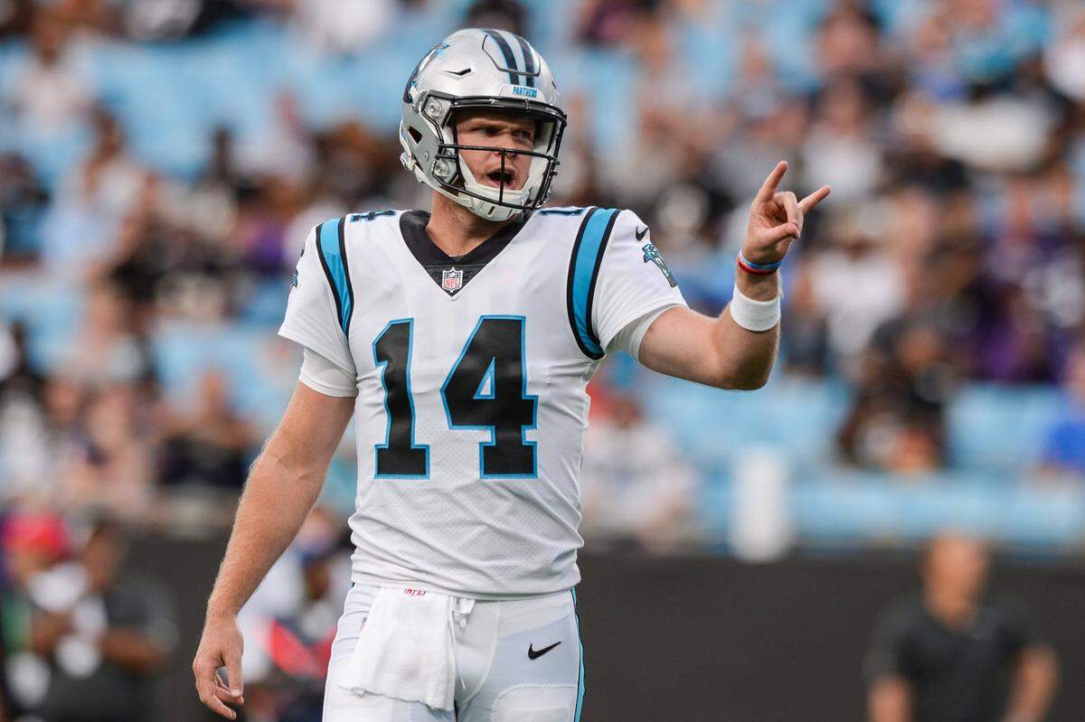Panthers quarterback Sam Darnold gestures to teammates between plays during the pre-season game against the Ravens on Saturday, August 21, 2021 at Bank of America Stadium.