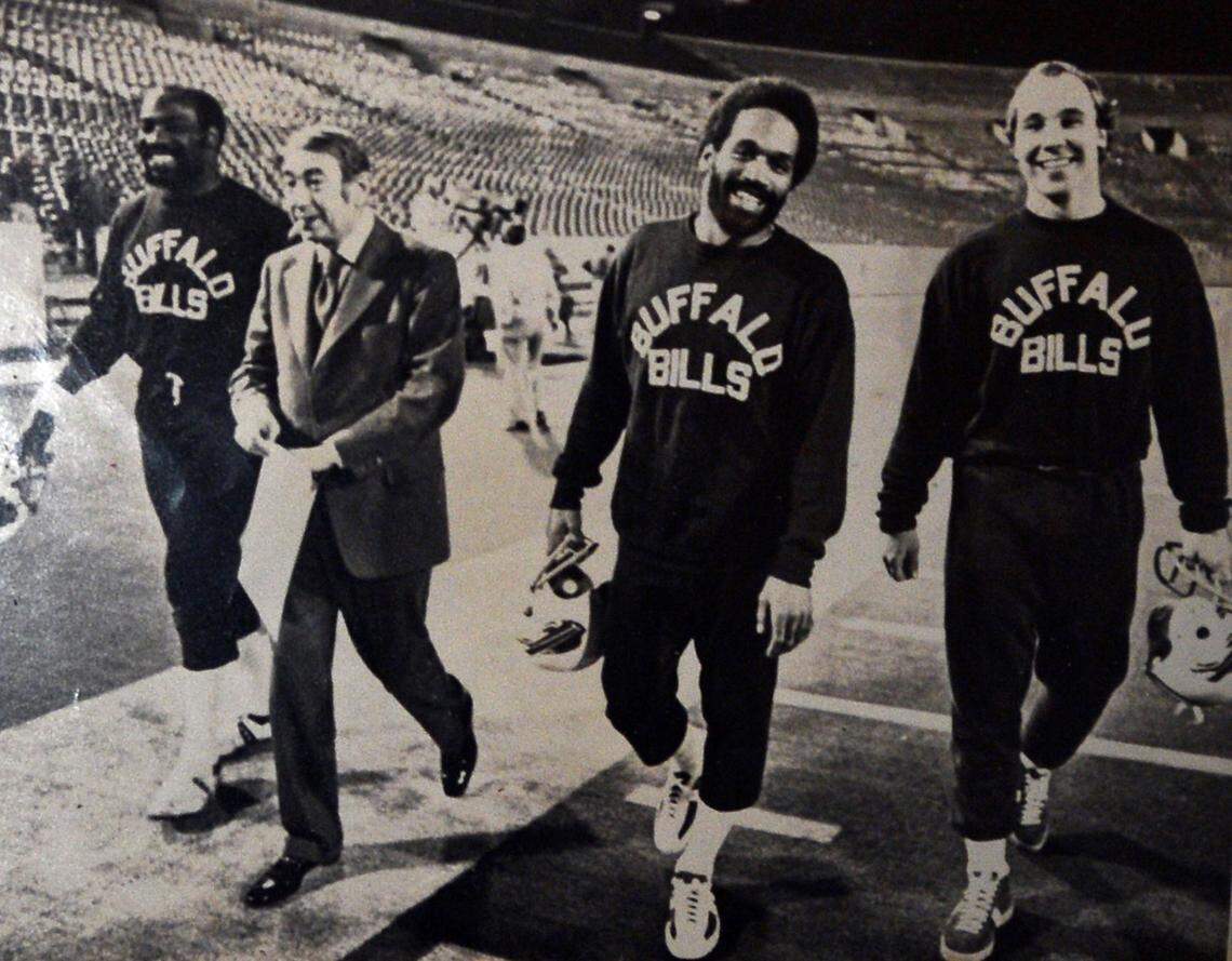 (L-R) Reggie McKenzie, announcer Howard Cosell, O.J. Simpson and Joe DeLamielleure. All but Cosell were teammates with the Buffalo Bills. DeLamielleure, a Pro Football Hall of Famer, keeps a copy of this picture at his home. Simpson’s death was announced, at age 76, on April 11, 2024.
