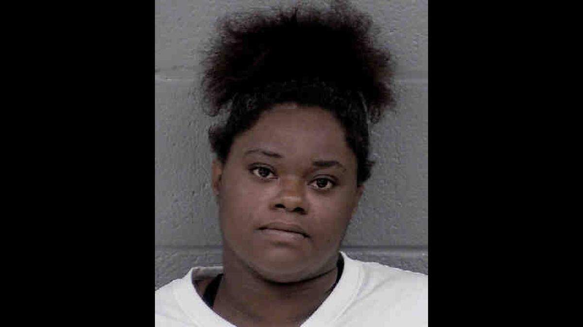 Kiara Murphy, 26, has been charged with murder and armed robbery in connection with a deadly shooting at a South Boulevard fast food restaurant, police said.