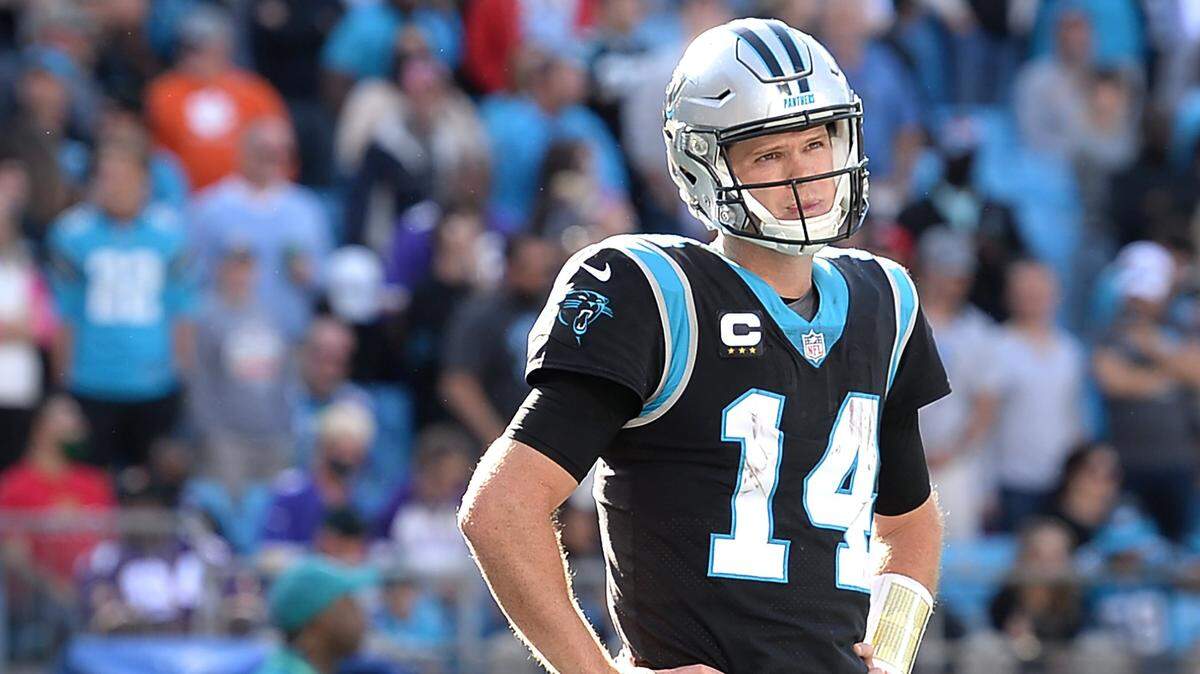 Carolina Panthers quarterback Sam Darnold stands outside the team huddle during action against the Minnesota Vikings at Bank of America Stadium in Charlotte, NC on Sunday, October 17, 2021. The Vikings defeated the Panthers 34-28.