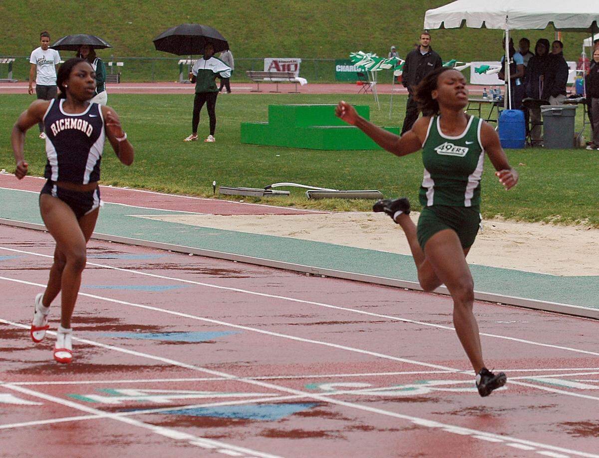 Shareese Woods Hicks (right) was a four-time All-American at Charlotte and won 15 event Atlantic 10 conference titles.