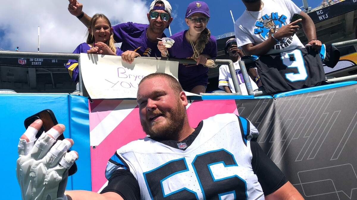 Carolina Panthers center Bradley Bozeman takes a selfie with fans prior to the team’s game against the Minnesota Vikings on Sunday, October 1, 2023 at Bank of America Stadium in Charlotte, NC.