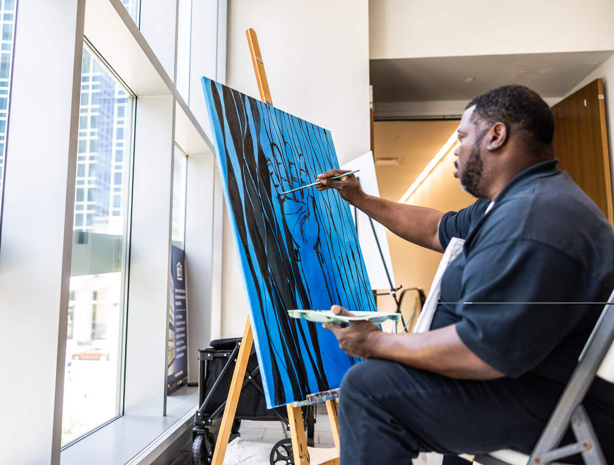 Charlotte based artist, Curtis King, works on a painting during Juneteenth at The Gantt at Harvey B. Gantt Center for African-American Arts + Culture in Charlotte, N.C., on Friday, June 19, 2026.