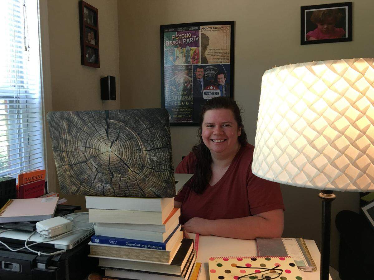 Jessica Zingher, managing director of Warehouse Performing Arts Center, in her home “studio.” She directed the group’s recent online play reading from her home.