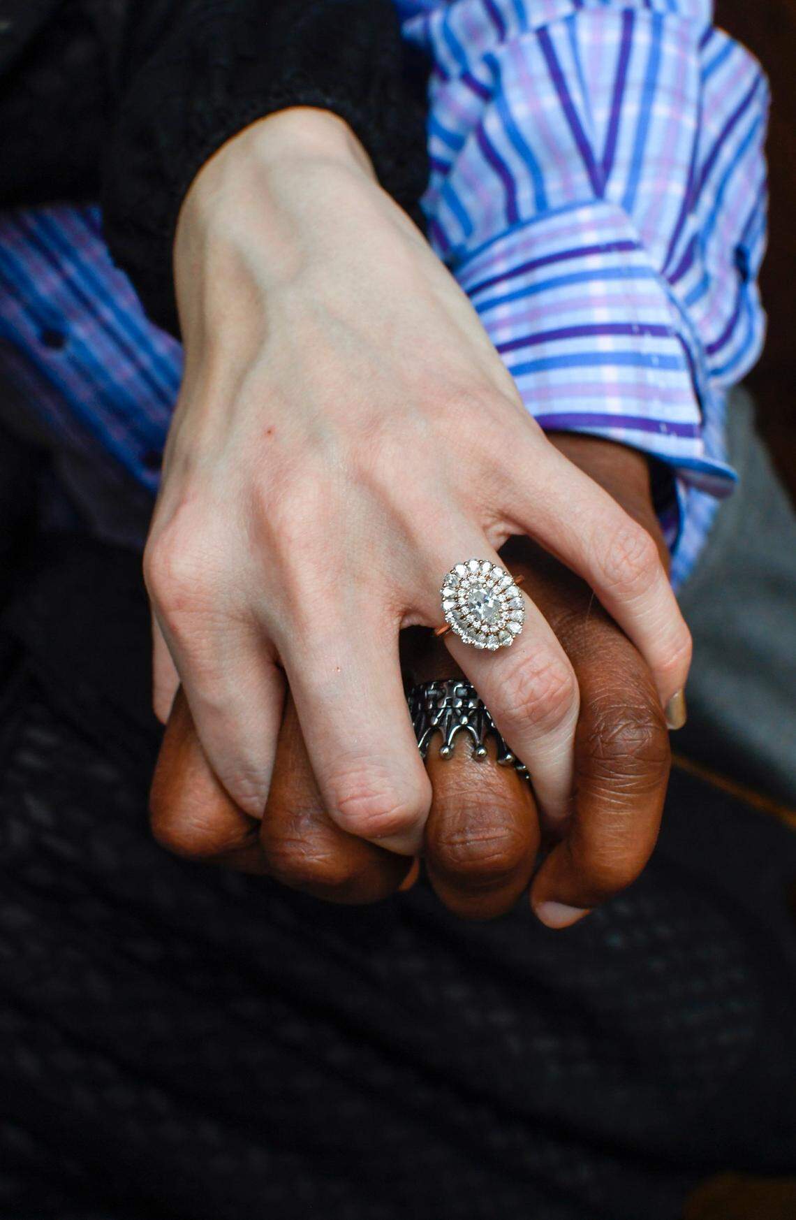 Fred and Markely Shropshire pose for a photo of their wedding rings at their home on Friday, February 4, 2022 in Charlotte, NC.