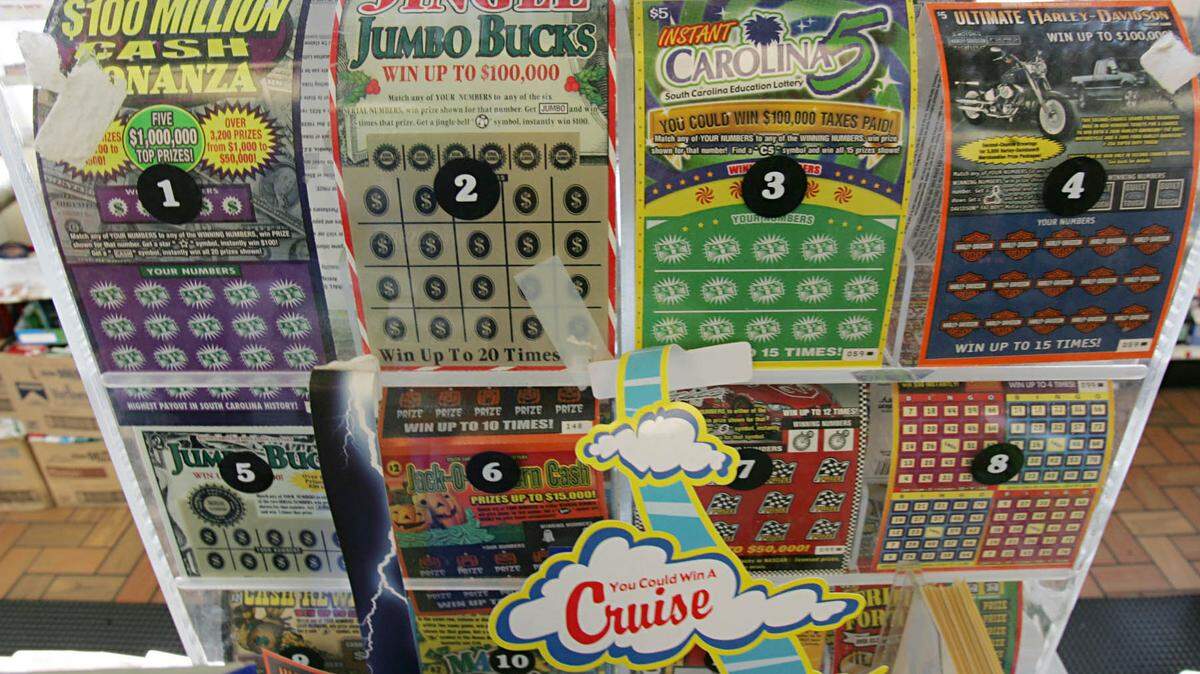 South Carolina Education Lottery scatch-off lottery tickets are displayed on the counter at the Exxon Station on Blossom Street Thursday, Dec. 29, 2005, in Columbia, S.C. A Charleston County man filed a lawsuit against the state lottery for fraud, claiming unethical advertising caused him to buy scratch-off lottery tickets for prizes already won by someone else. (AP Photo/Mary Ann Chastain)