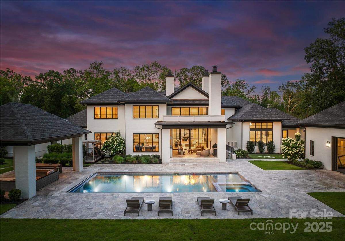 The 1.6-acre fenced property also includes a resort-style pool, a covered cabana and a full-size sports court.